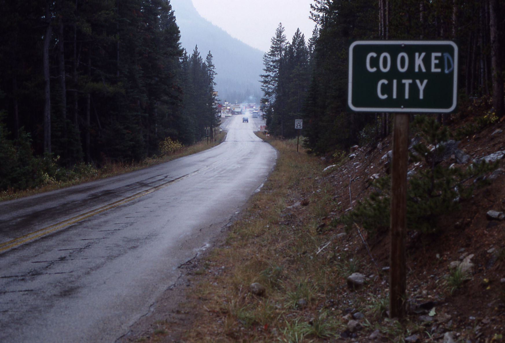 Graffiti on Cooke City sign